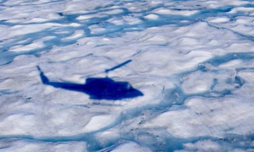 Helicopter shadow over ice
